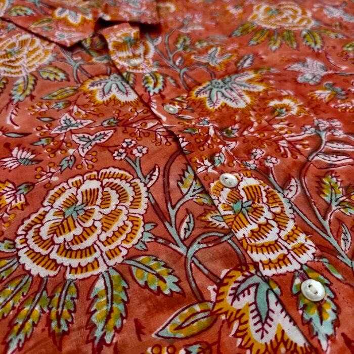 adhukala shirt close up orange flower